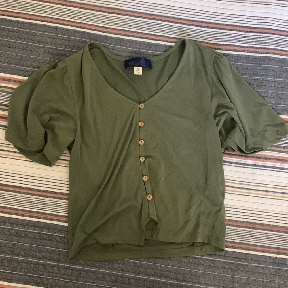 Francesca’s green blouse